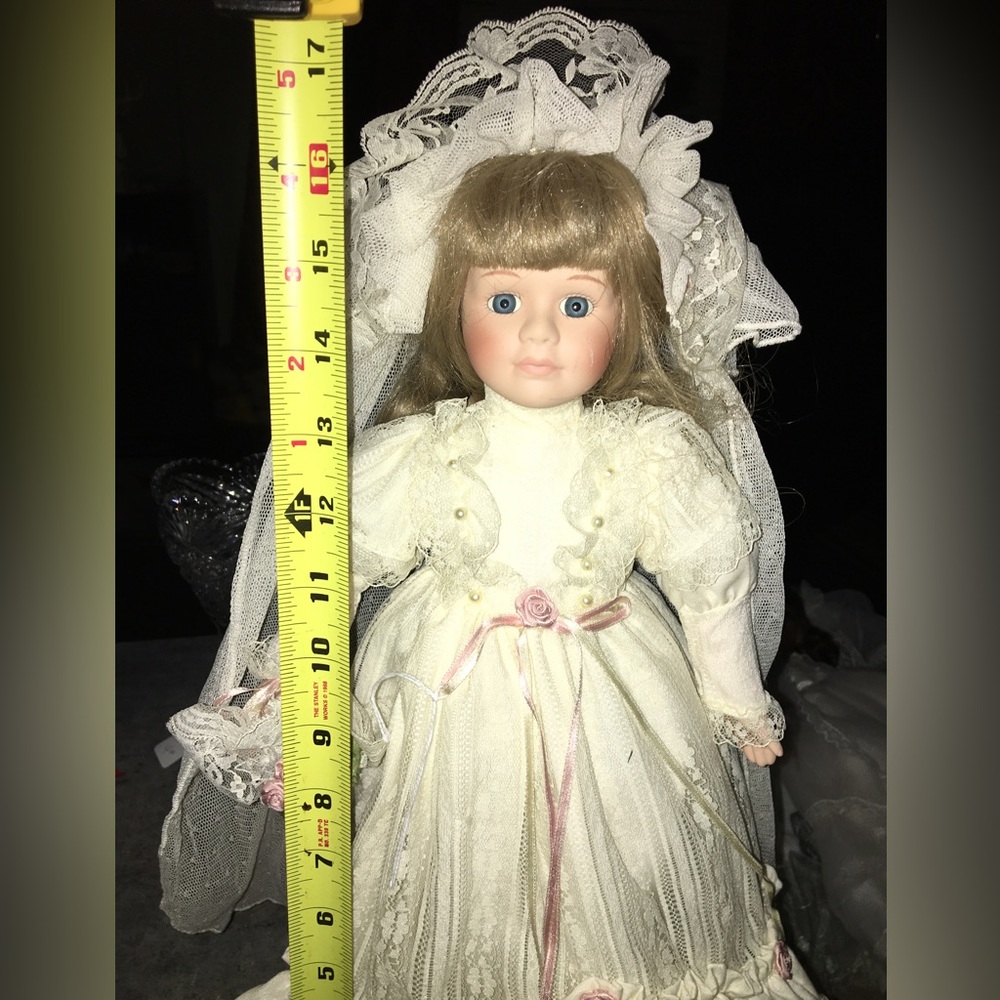 Very beautiful porcelain doll great condition she is tall comes with stand